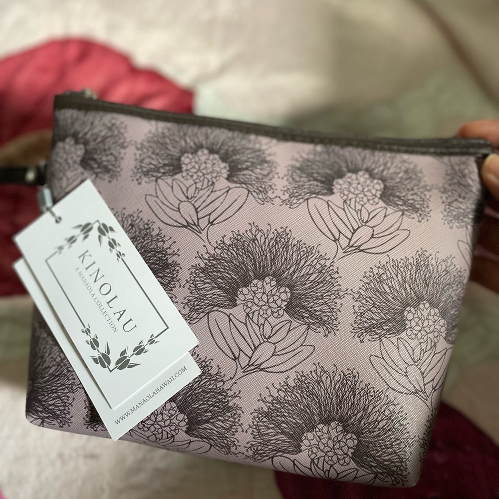 NWT, never used. Manaloa Kalihilehua Plum colored zip pouch